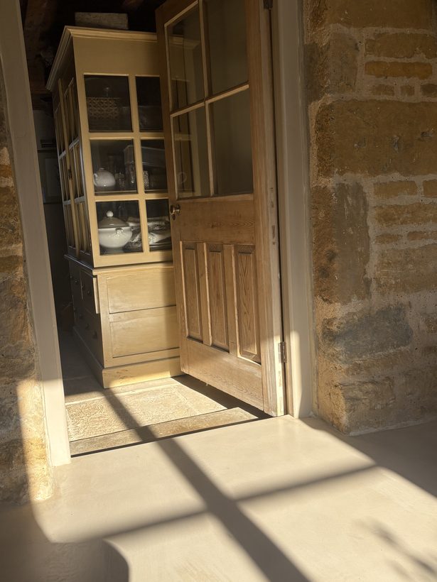 Lapwing House — sunlit doorway to the pantry