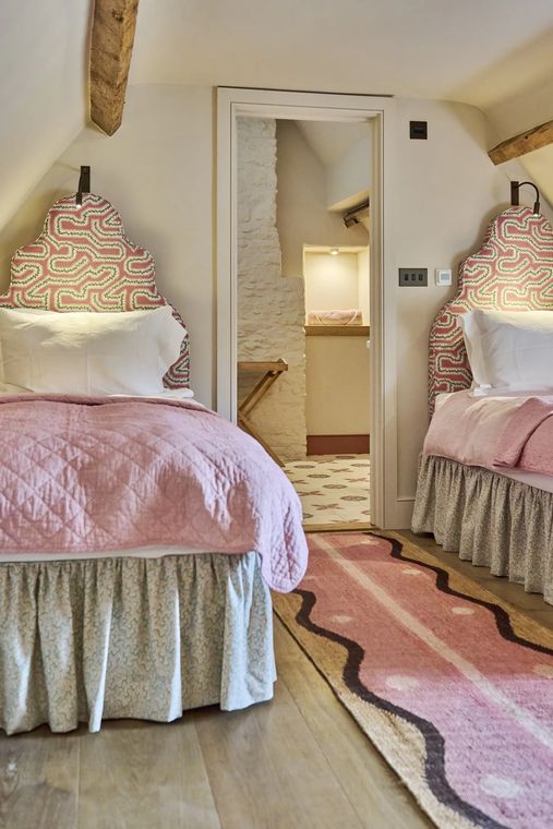 The Shambles — twin bedroom with upholstered headboards under the eaves